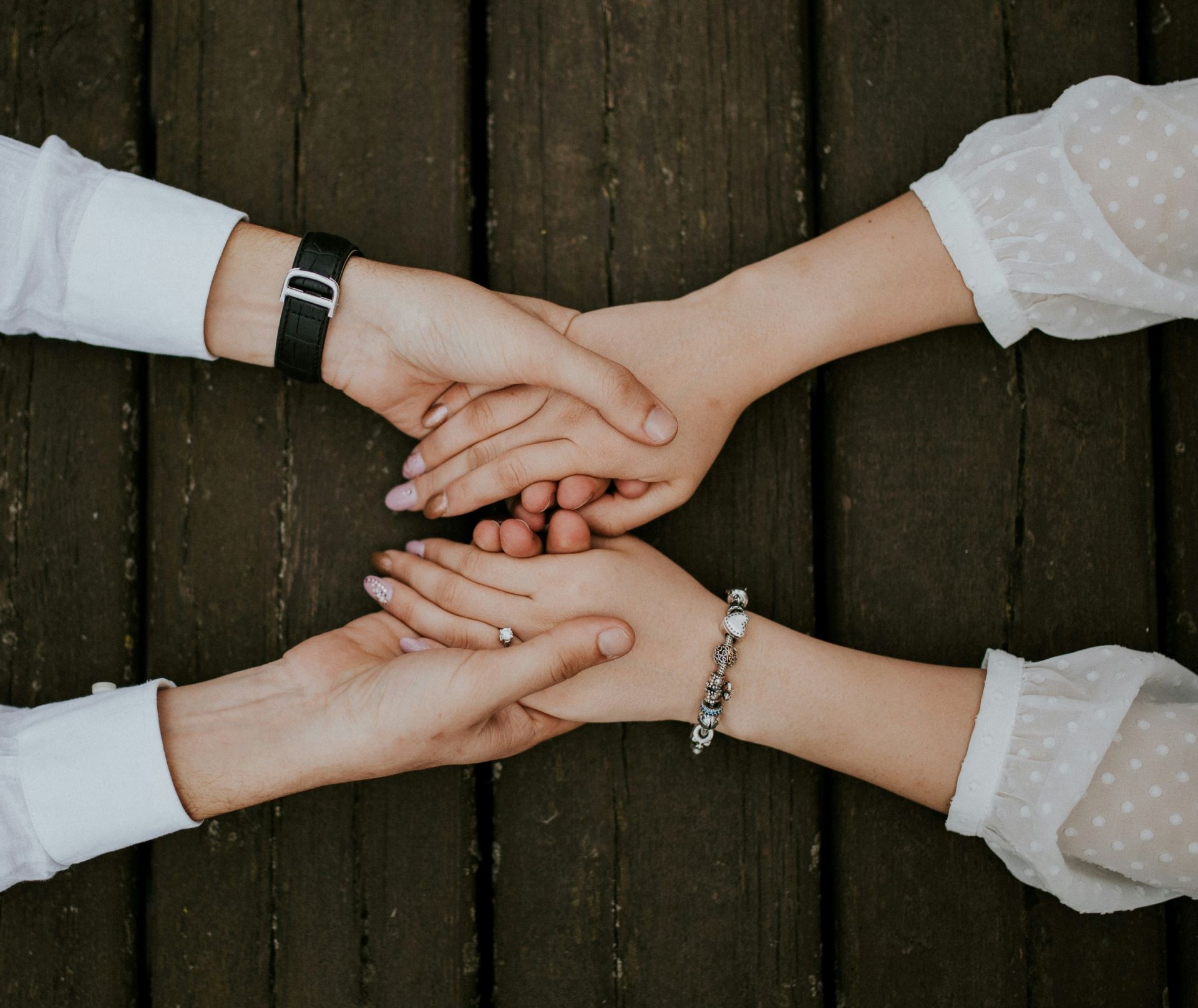 Two people holding hands